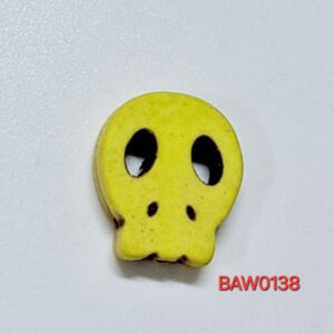 Manik tengkorak gepeng warna kuning