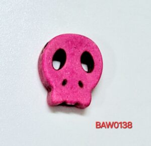 Manik tengkorak gepeng warna pink
