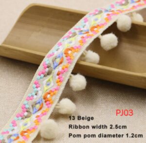 Renda bordir etnik dengan hiasan pompom warna beige